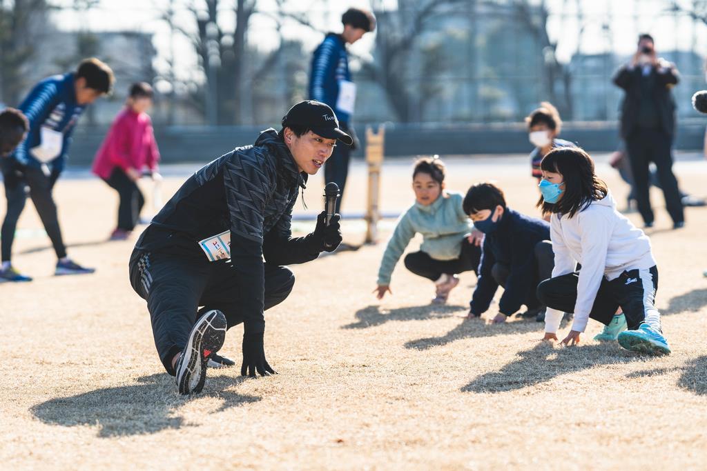 参加者とアスリートで準備体操